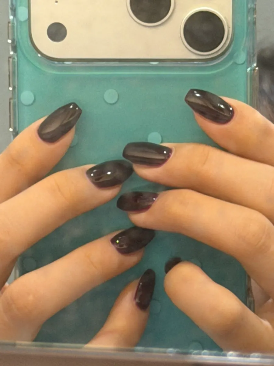 Glossy burgundy-brown gel nails