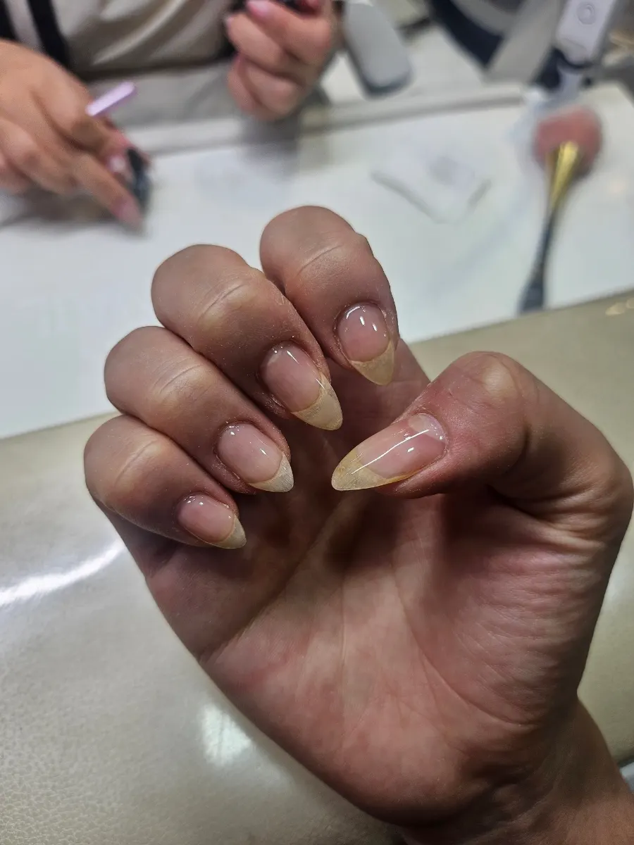 Nails with gel removed, cuticles cleaned, and base applied