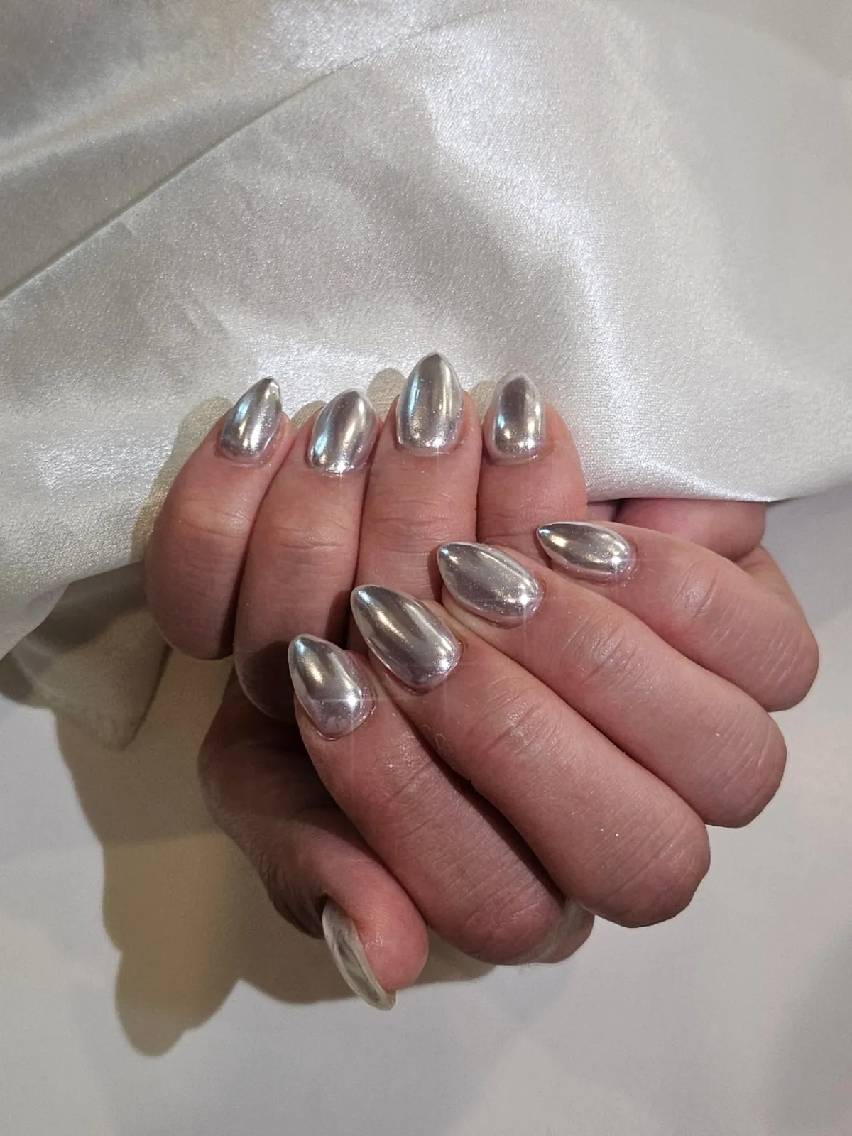 Metal silver gel nails with white base and silver powder