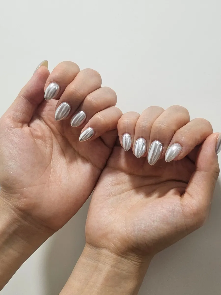 Finished metal silver gel nails, back-of-hand shot