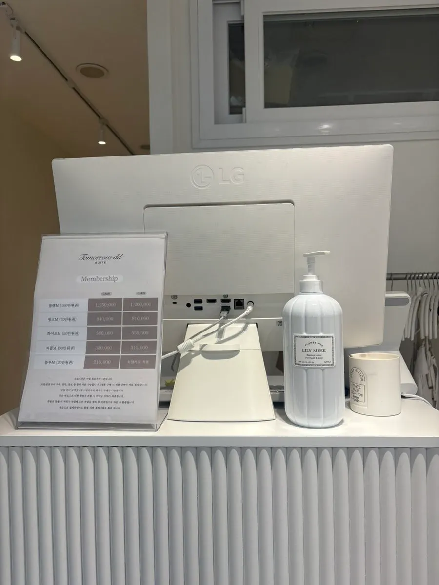 Hand cream and membership information on the table