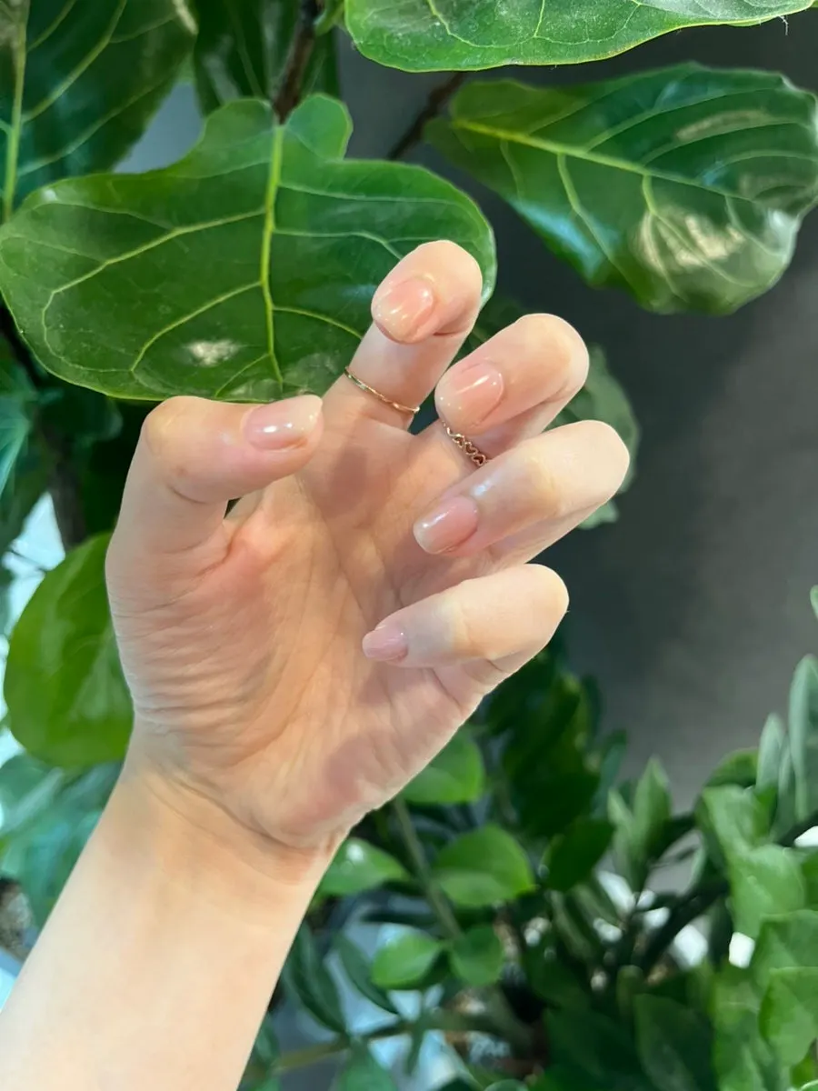 Subtly shimmering skin-tone gradient nails