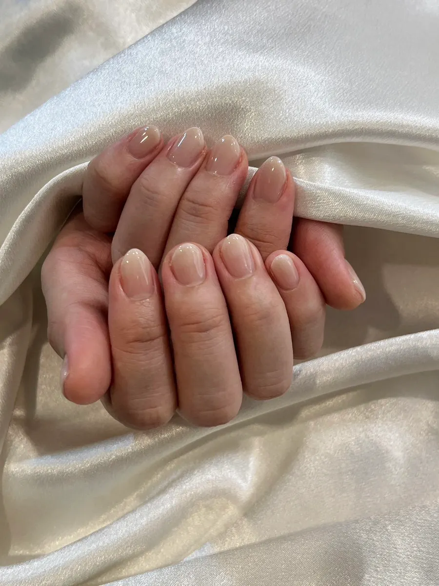 Applying the nude pink color during the treatment