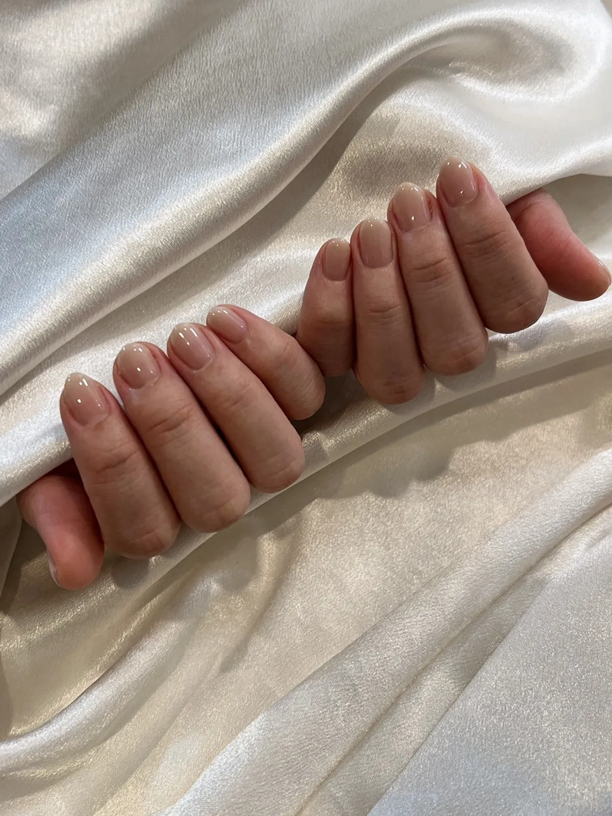 Finished nude pink gradient almond-shaped nails
