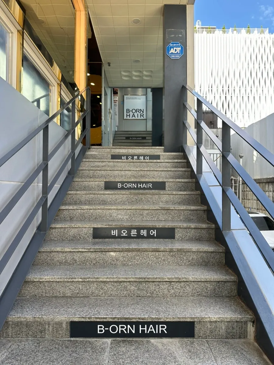 Staircase entrance leading up to Biorn Hair