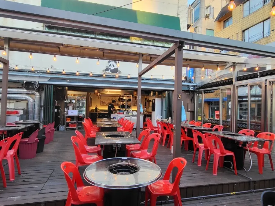 Outdoor tables lit up at dusk