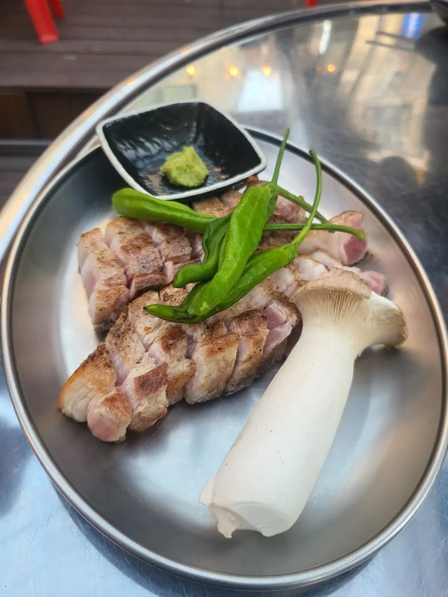 Two servings of pre-seared pork belly with basic side dishes