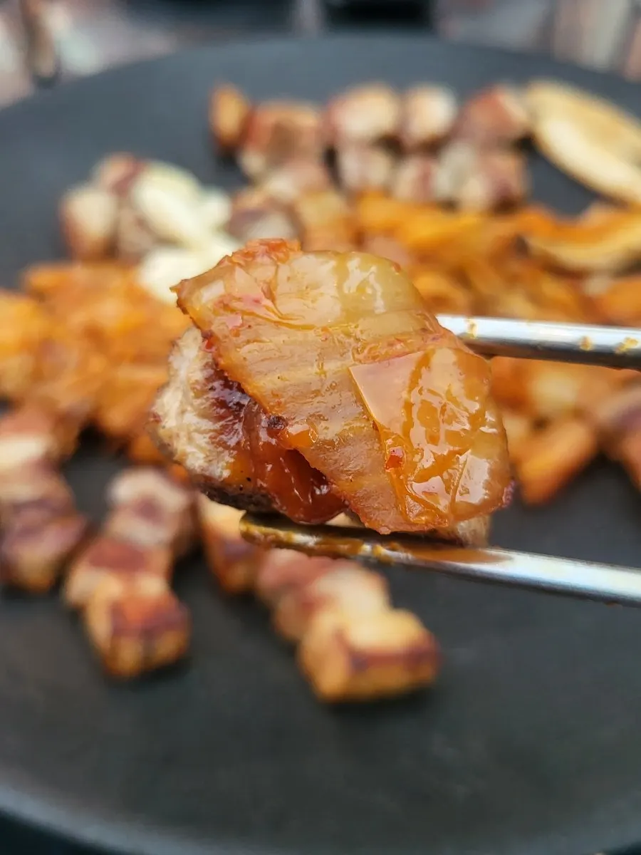 Pork belly served with grilled kimchi