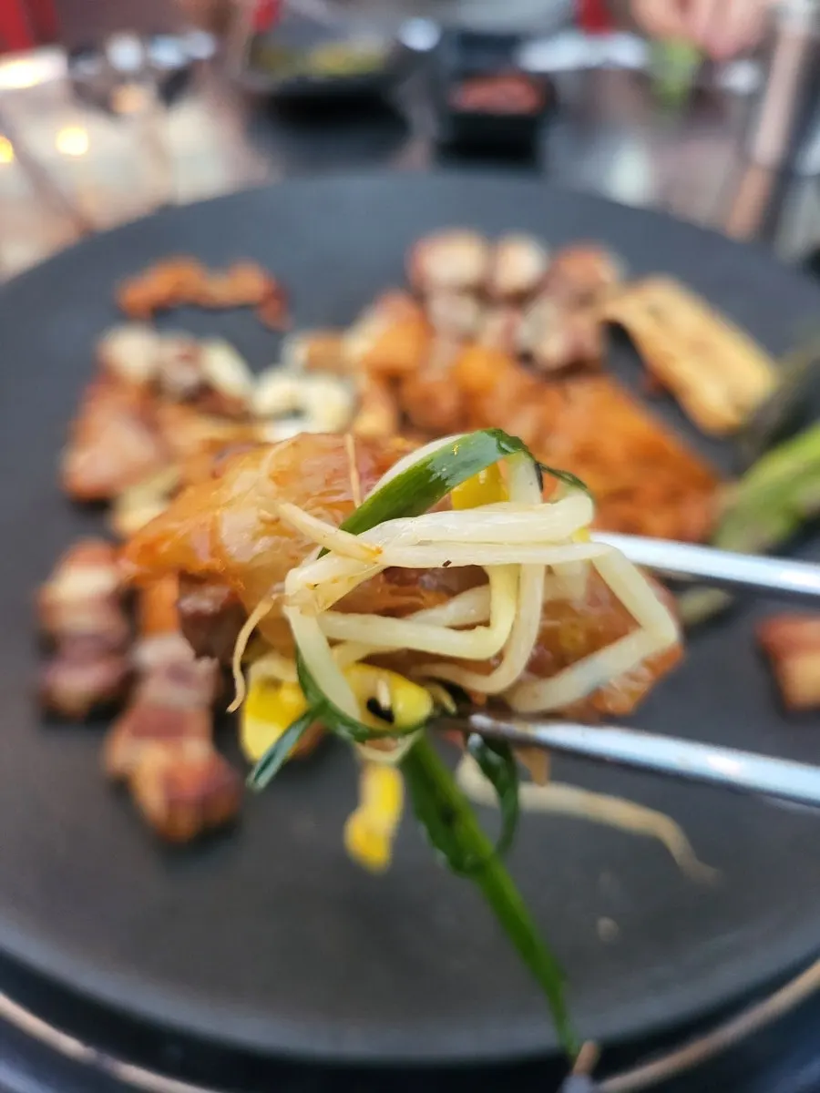 Table scene while eating pre-seared pork belly