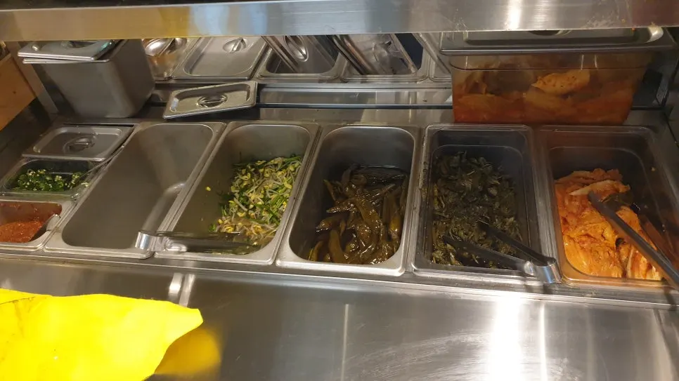 Close-up of the self-service bar packed mostly with vegetables