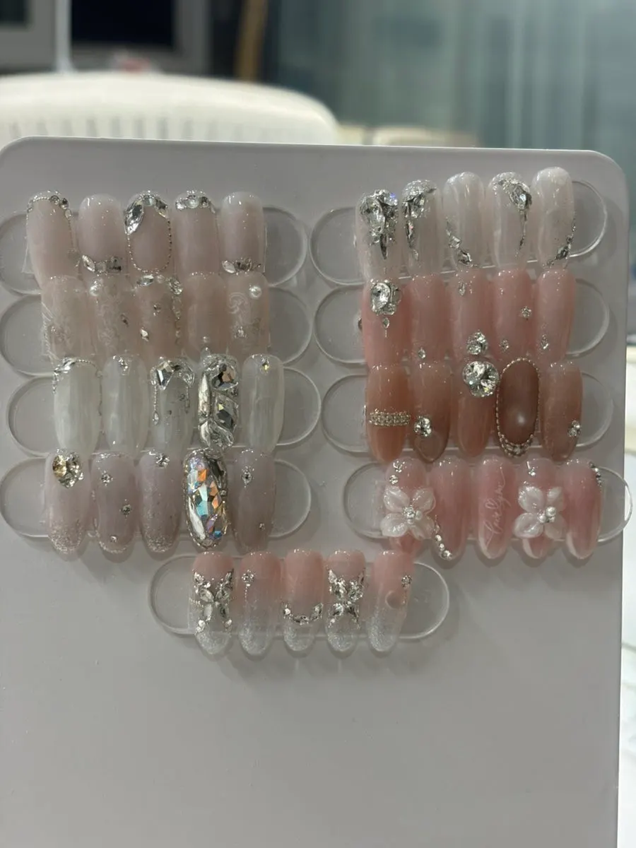 Browsing wedding nail designs at Naeil Didi