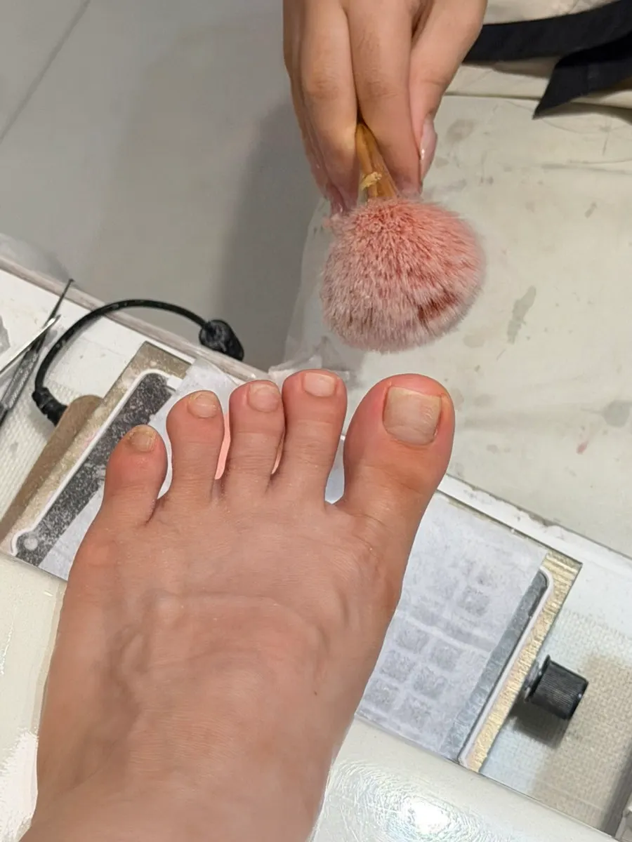 Feet receiving basic care treatment