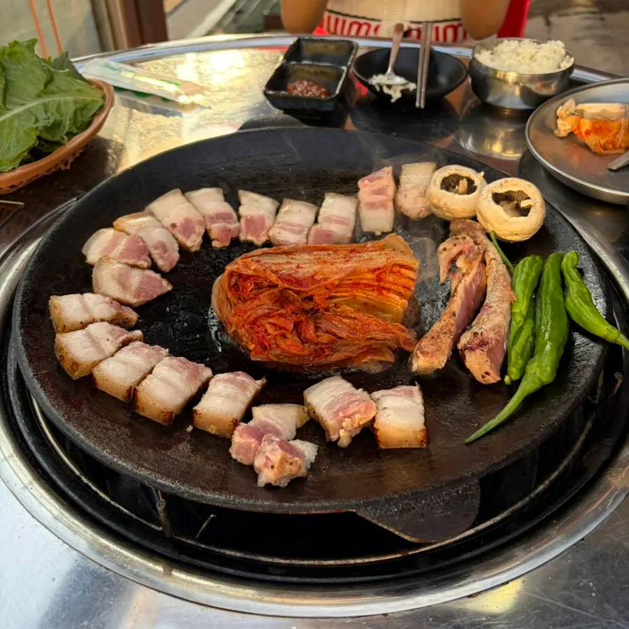Thick-cut bone-in pork belly placed on the table