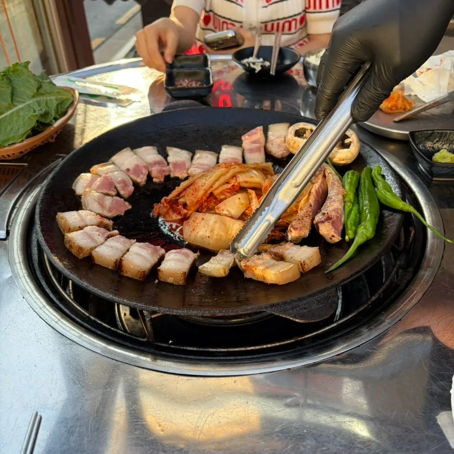 A full spread of grilled par-cooked bone-in pork belly