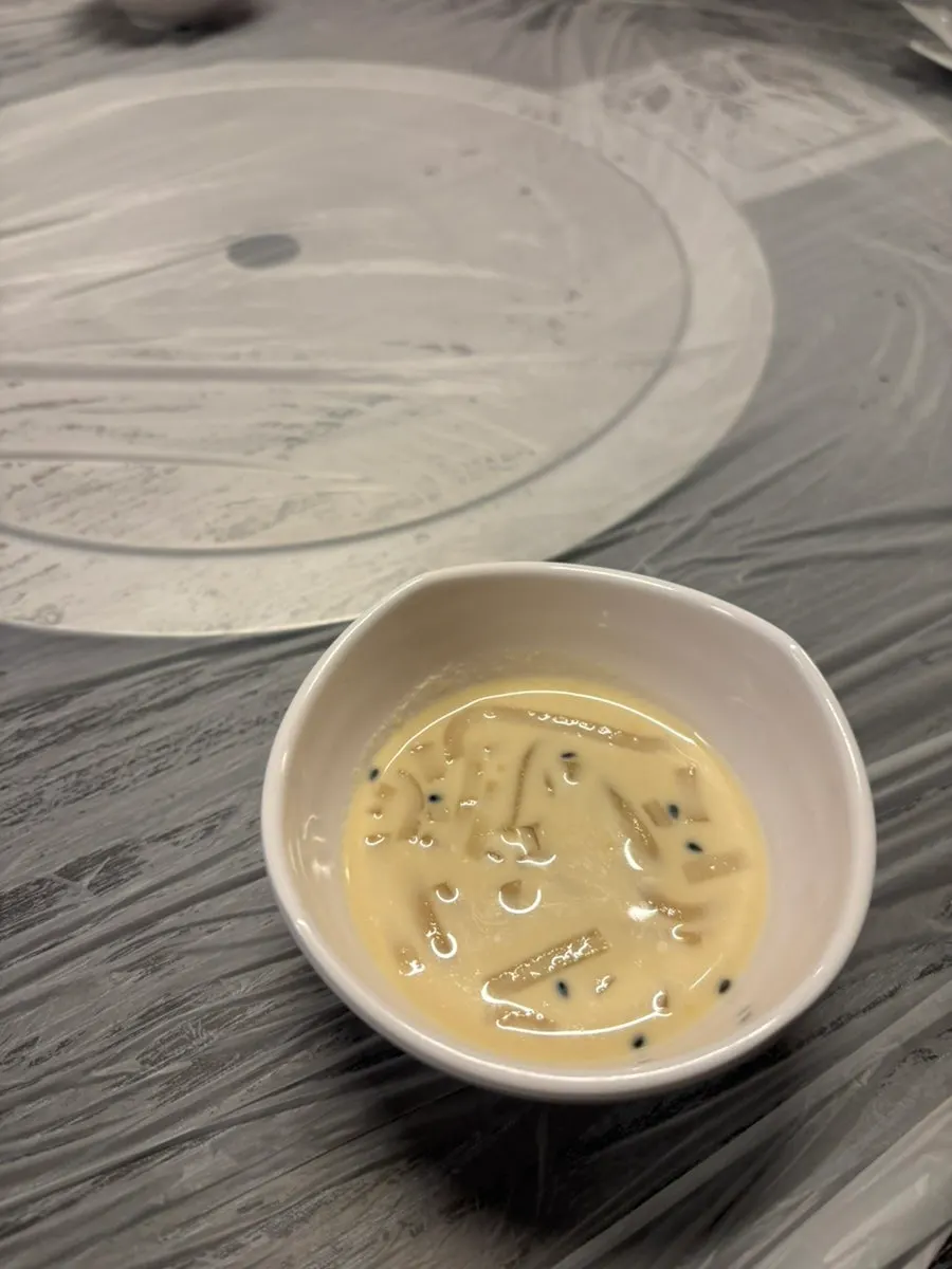 Complimentary side dishes for a soy-marinated crab meal
