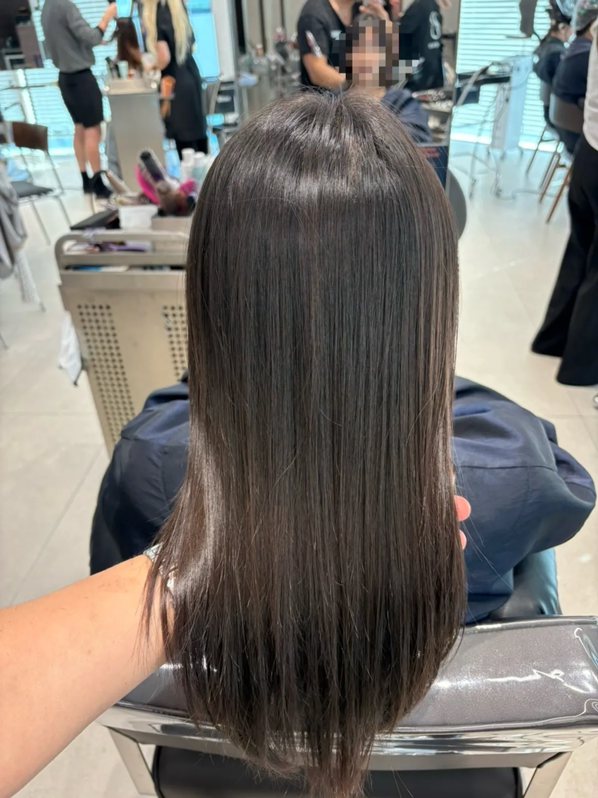 Mid-length hair styled after volume magic straightening