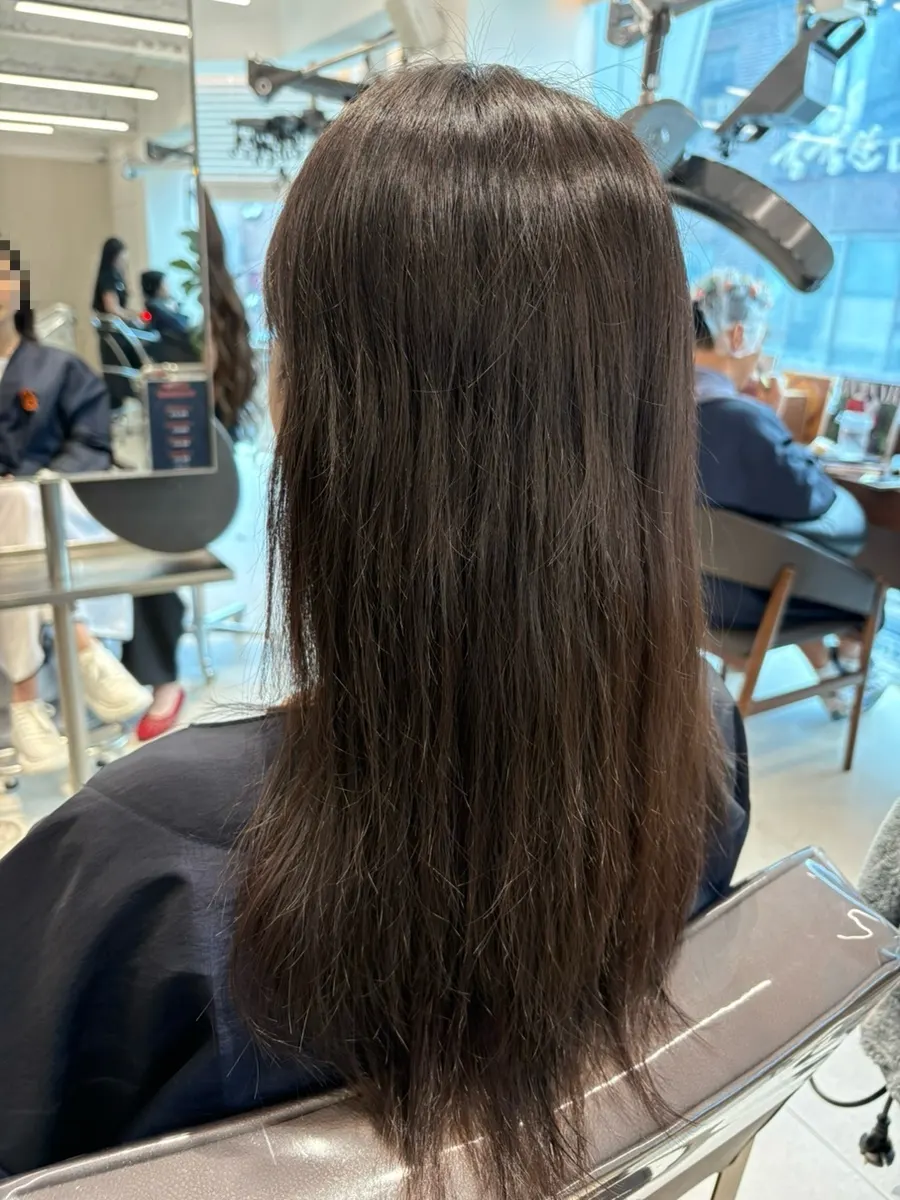 Checking hair condition during the consultation