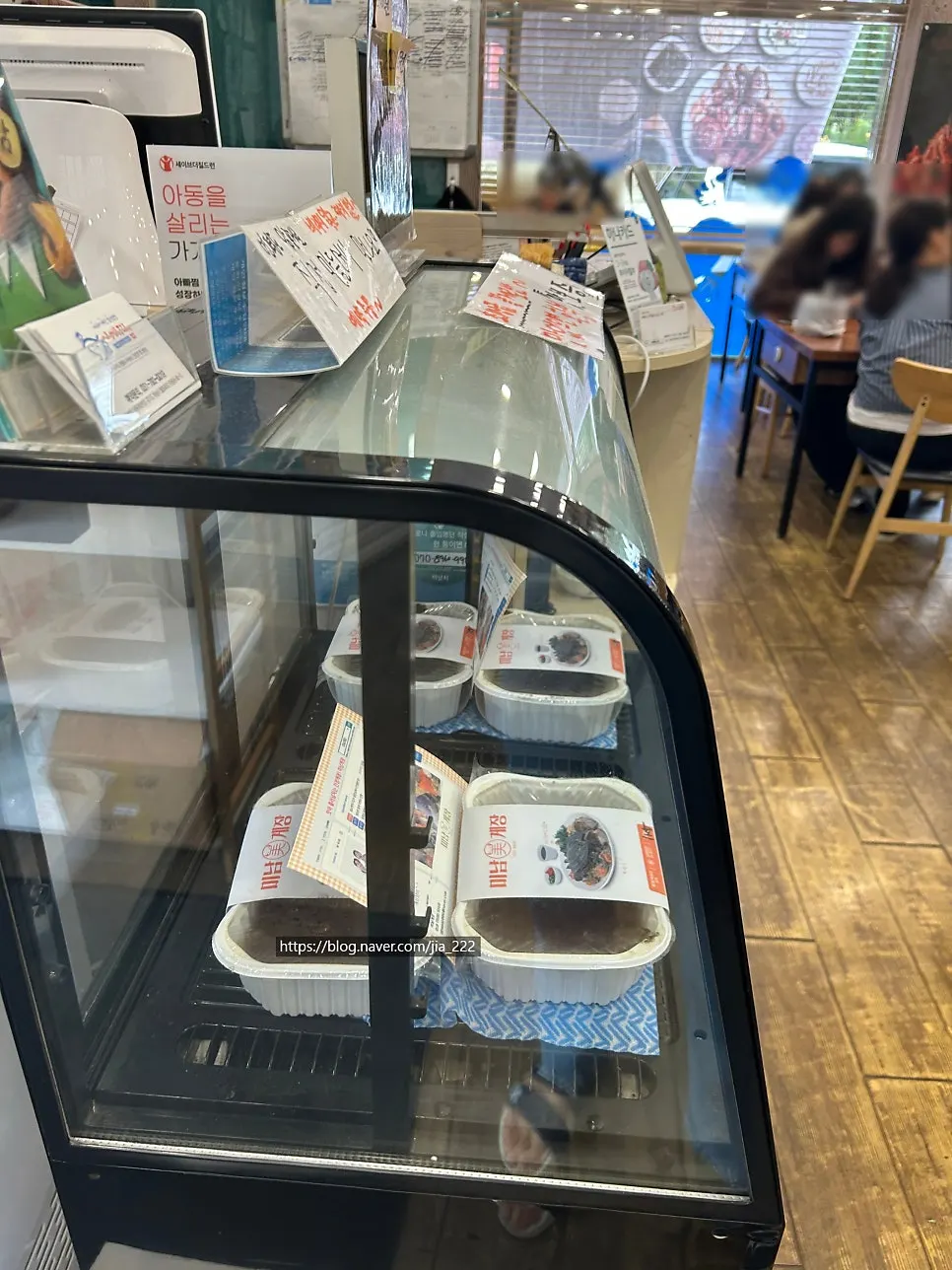 Refrigerated display case of Minam Gejang soy sauce and spicy marinated crab