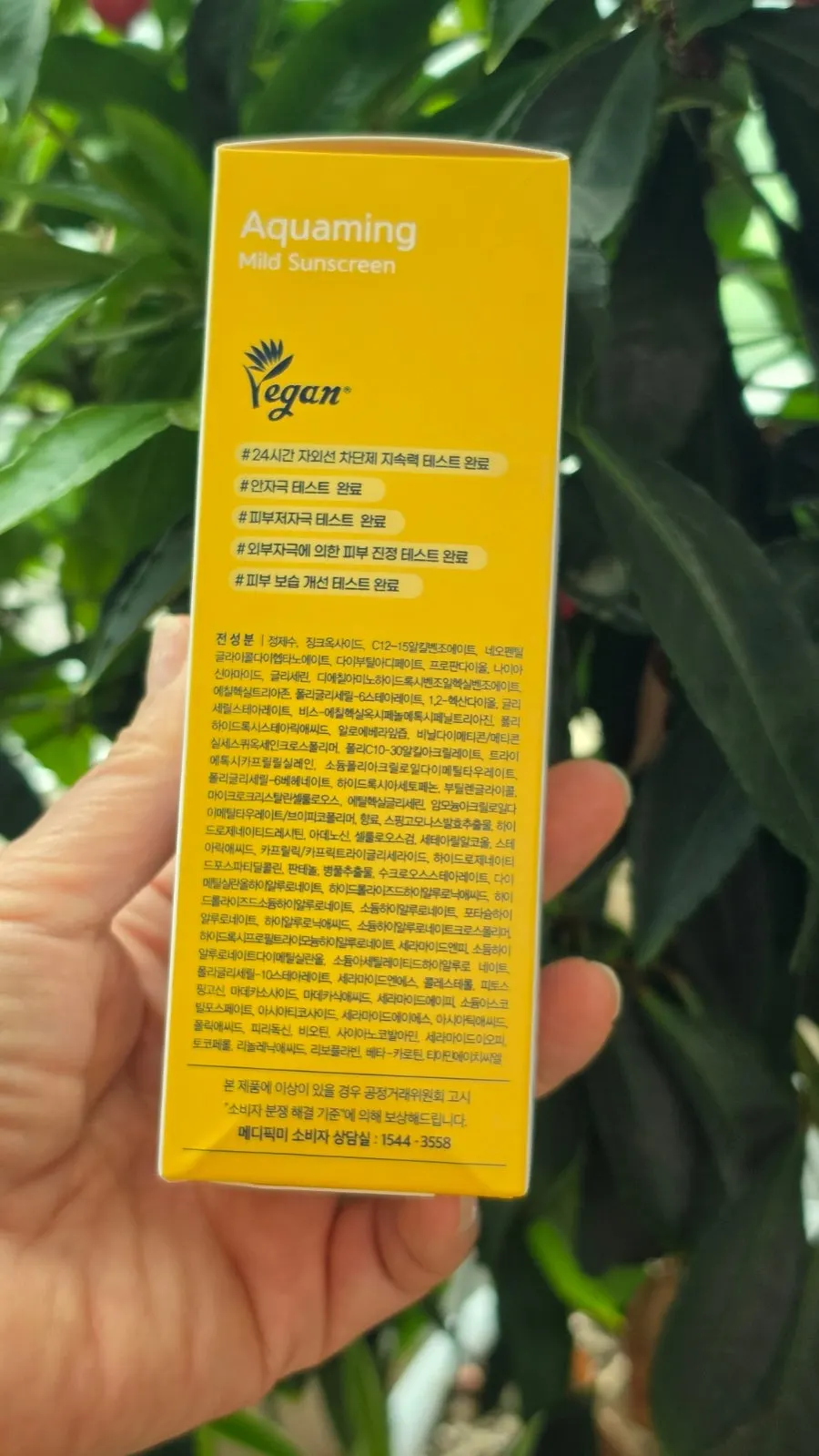 Close-up of MEDIPICKME Aquaming Mild Sunscreen tube