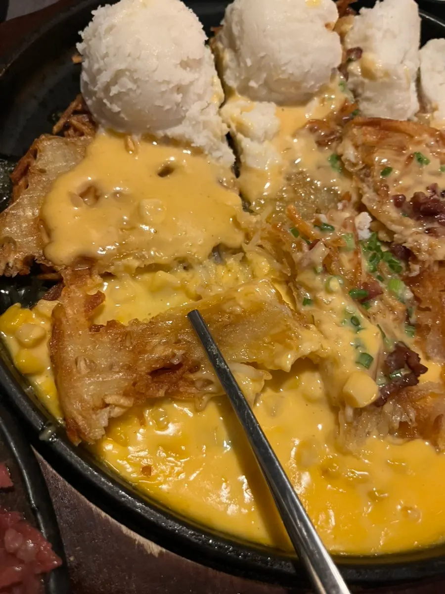 Cheese potato pancake served alongside the hot pot
