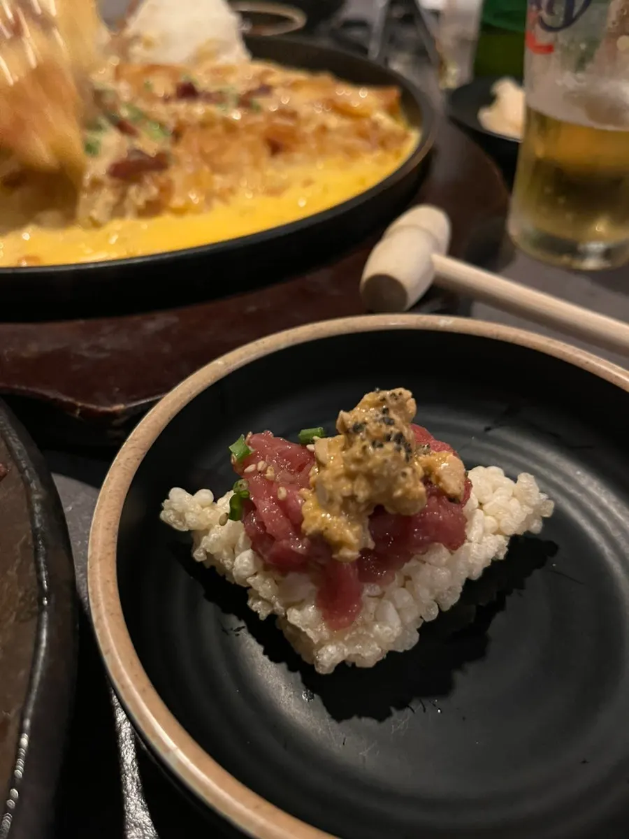 Eating monkfish liver yukhoe with crispy rice