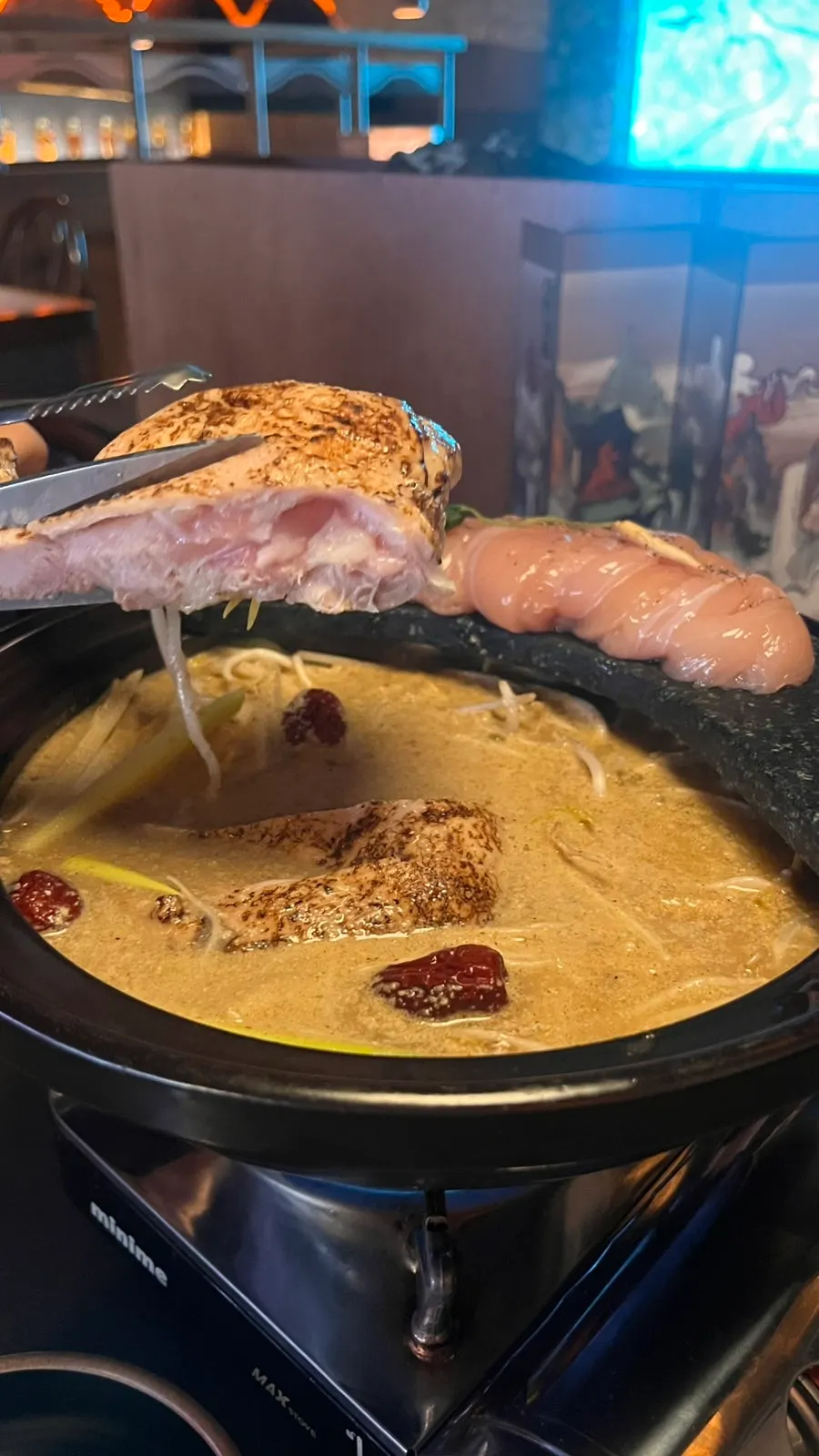 Inside the perilla chicken hotpot with vegetables and herbs