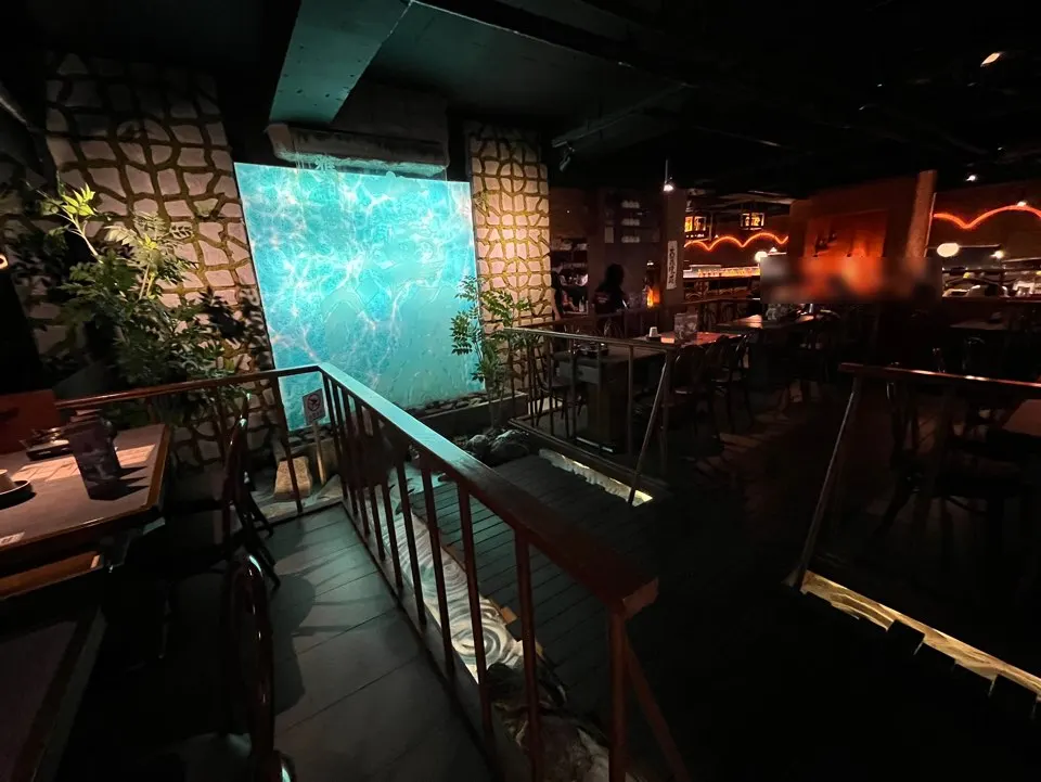 Large media waterfall wall and valley bridge interior