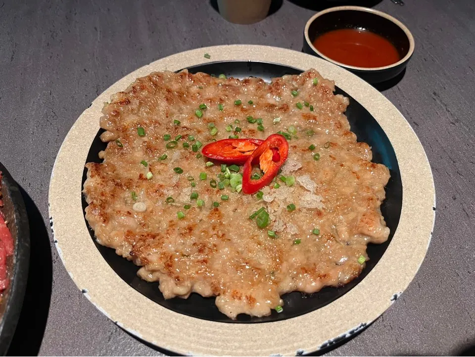 A plate of golden pan-fried chicken yukjeon