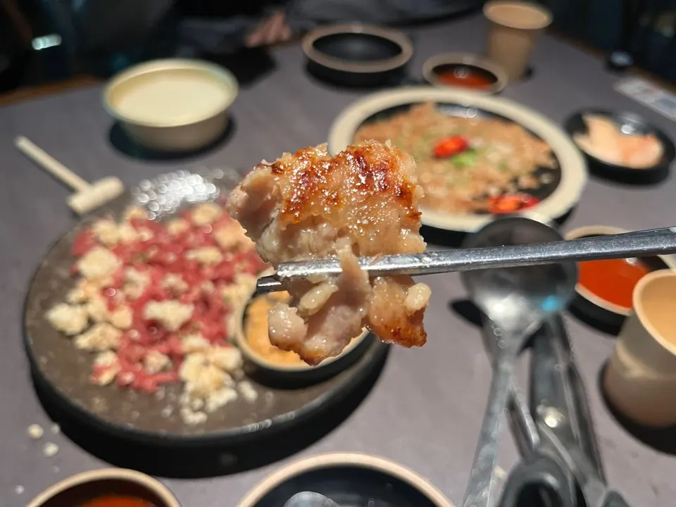 Torn piece of chicken yukjeon being picked up