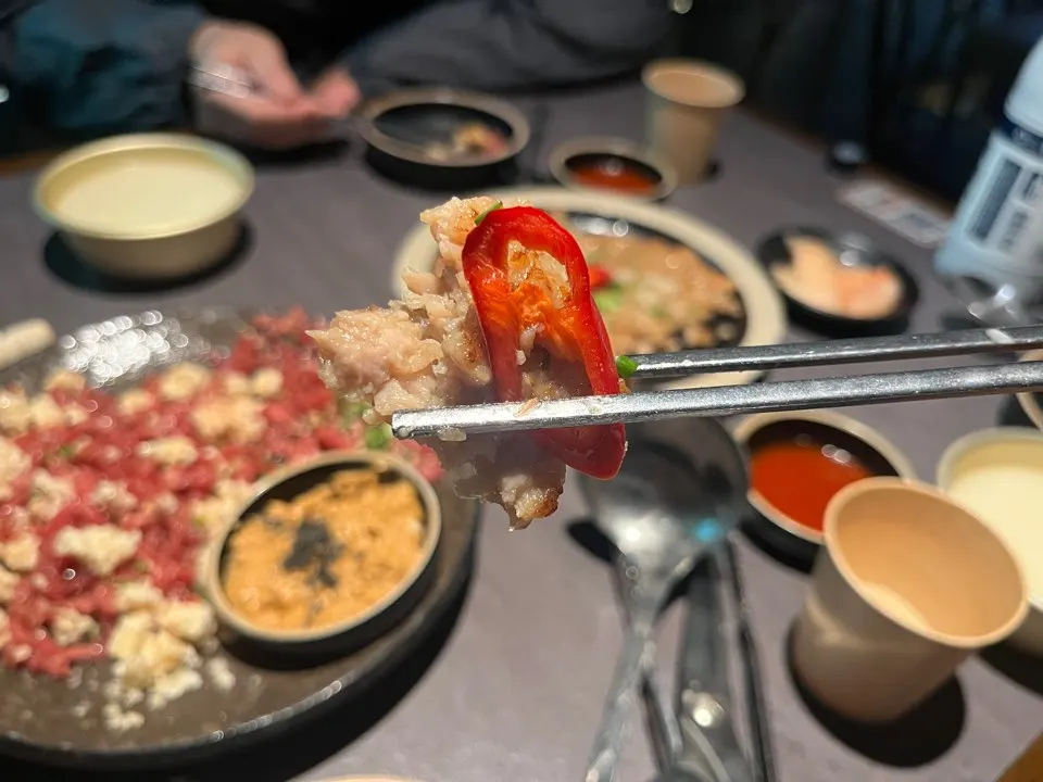 Chicken yukjeon dipped in spicy sauce