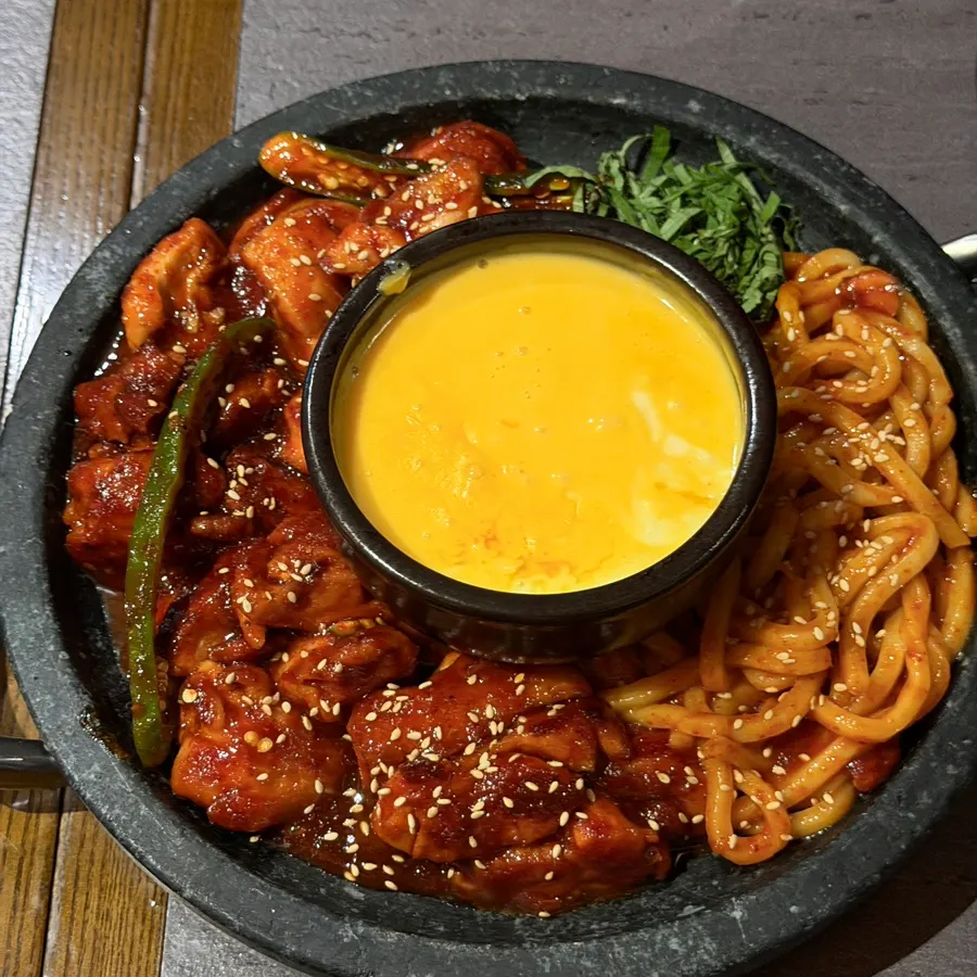Cheesy fire chicken hot pot piled high with cheese