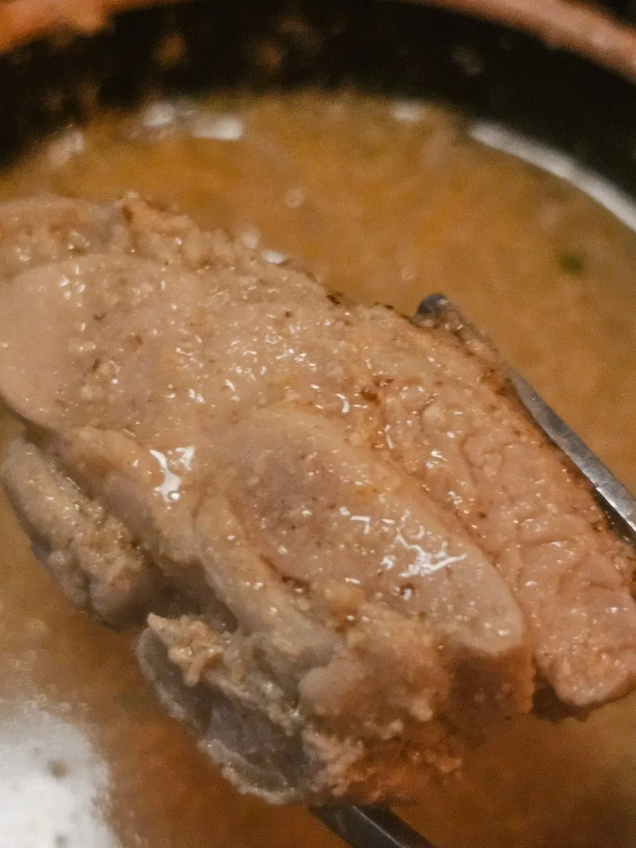 Chicken cooked tender in the hot pot