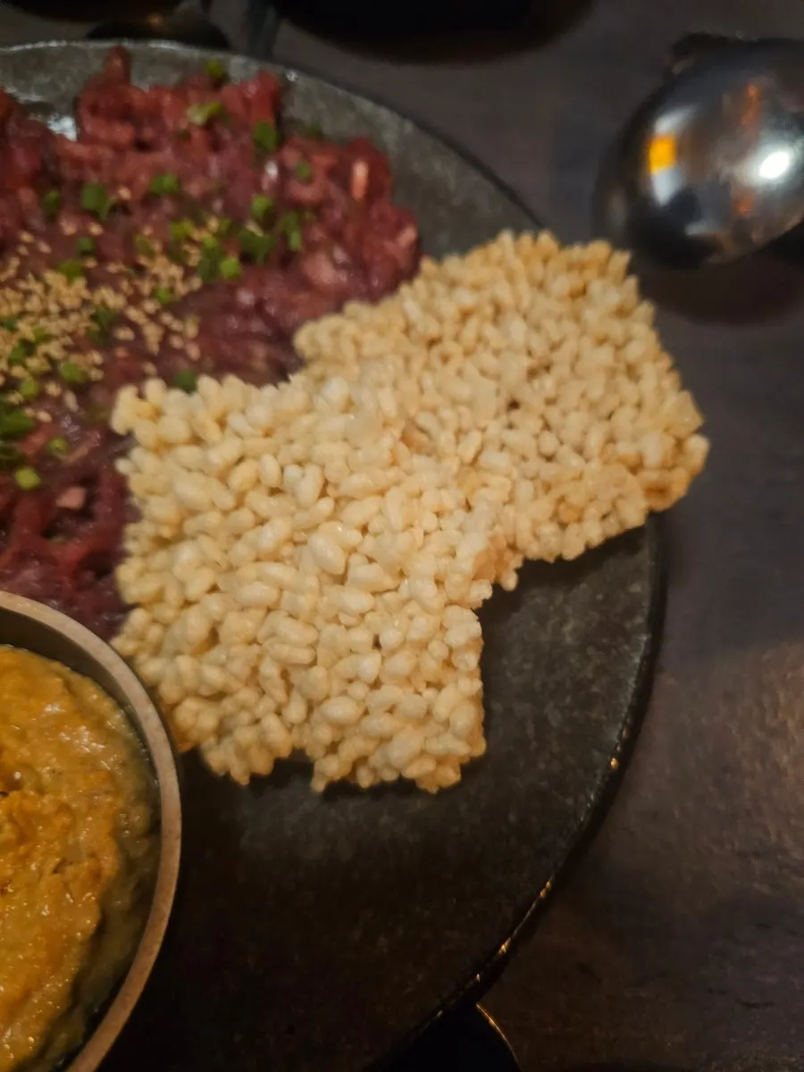 Nurungji monkfish liver hoe with raw beef, monkfish liver, and scorched rice