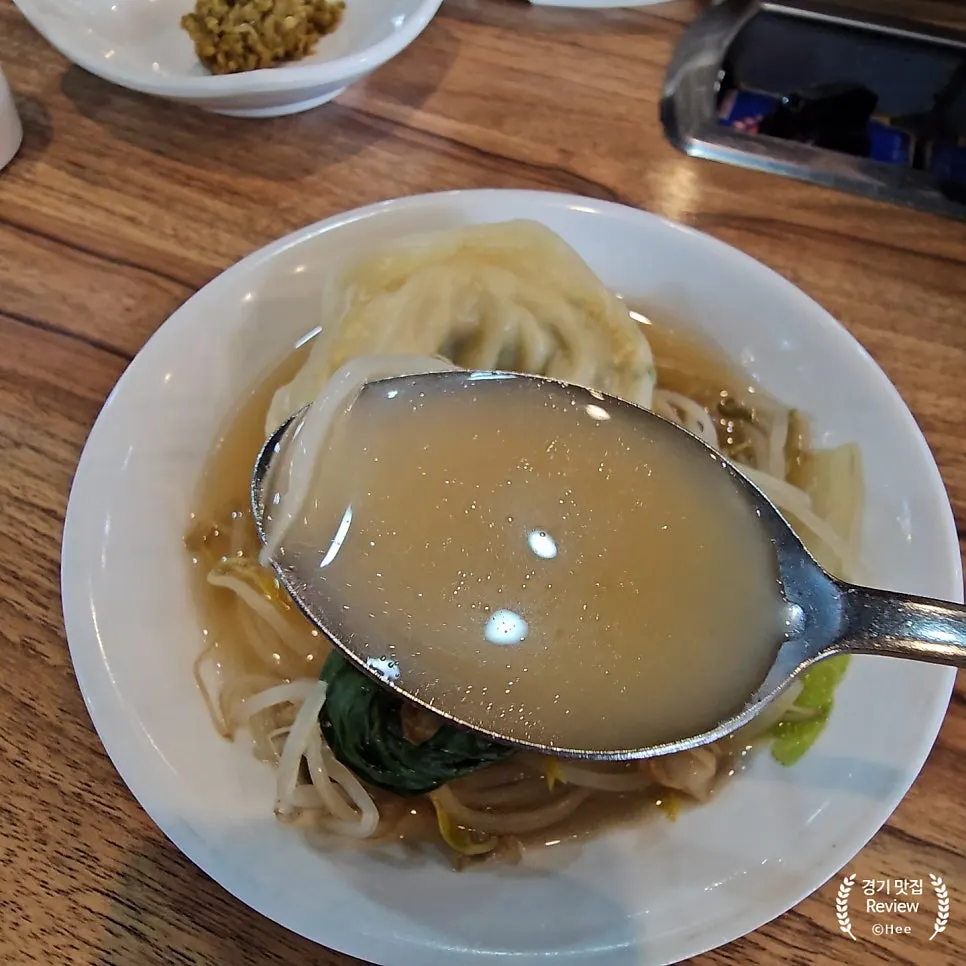 Dumplings and bean sprouts cooked in the boiling broth