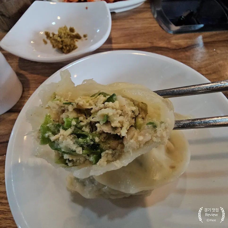 Small plate with dumplings and vegetables portioned out
