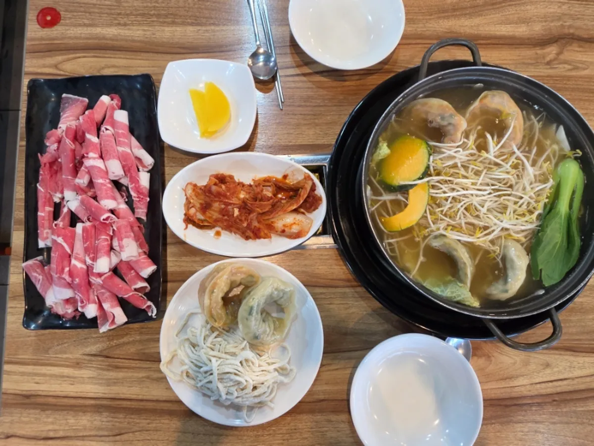 Full table setting of the Gaeseong Son Mandu Hot Pot Beef Shabu Set for two