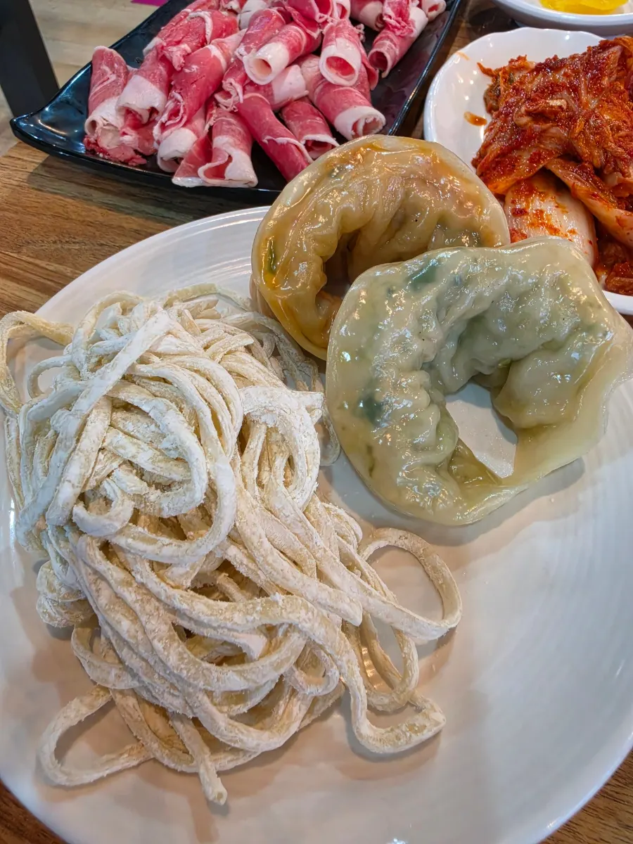 Plate of steamed dumplings served with the set