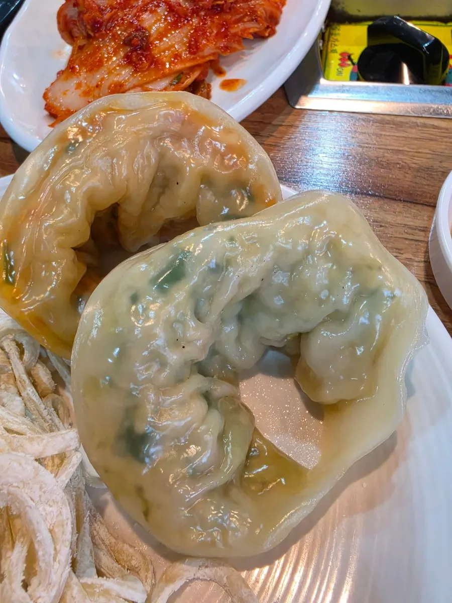 Handmade dumpling cut in half showing the filling