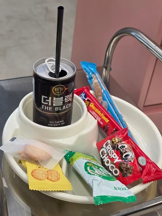 Canned drink selection: water, iced tea, cola, and more