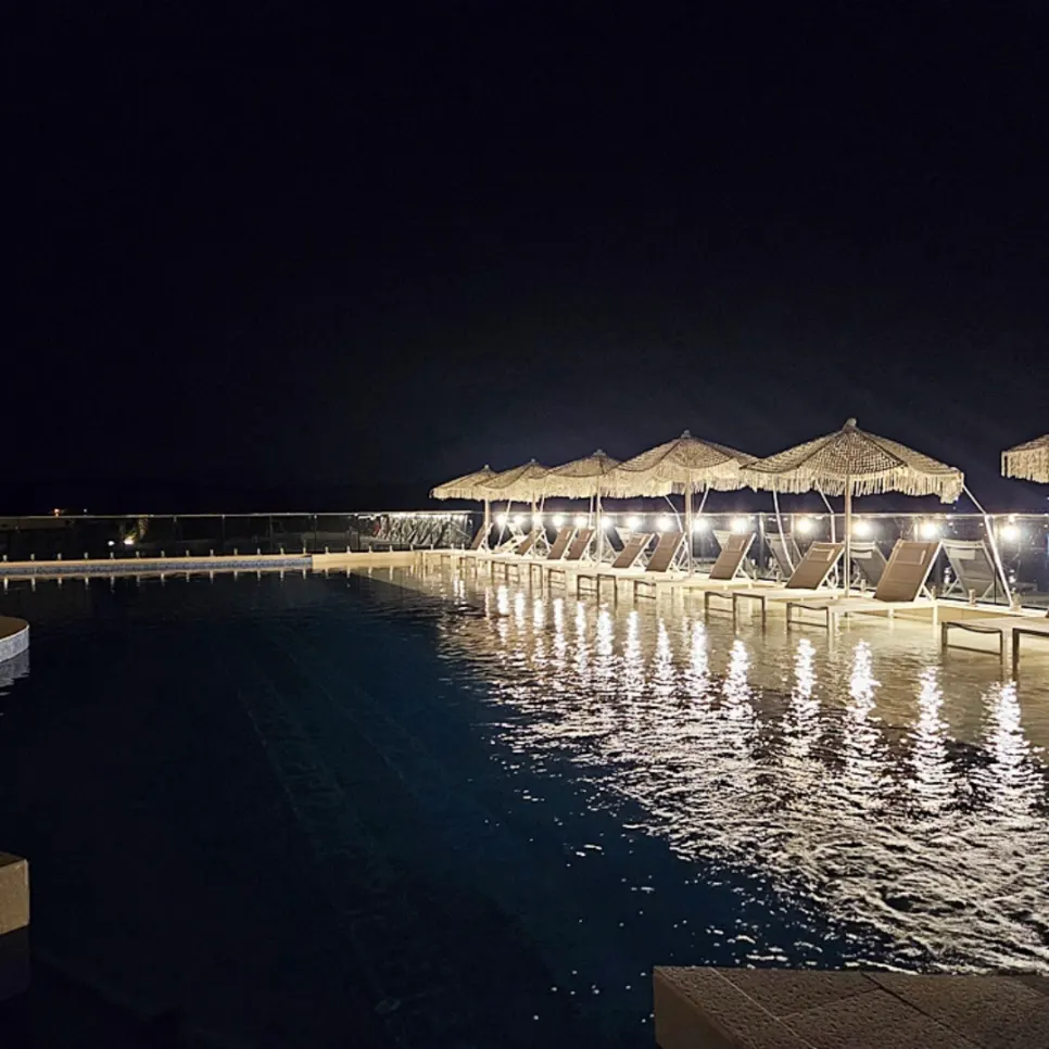 Night view of the pool villa after dark