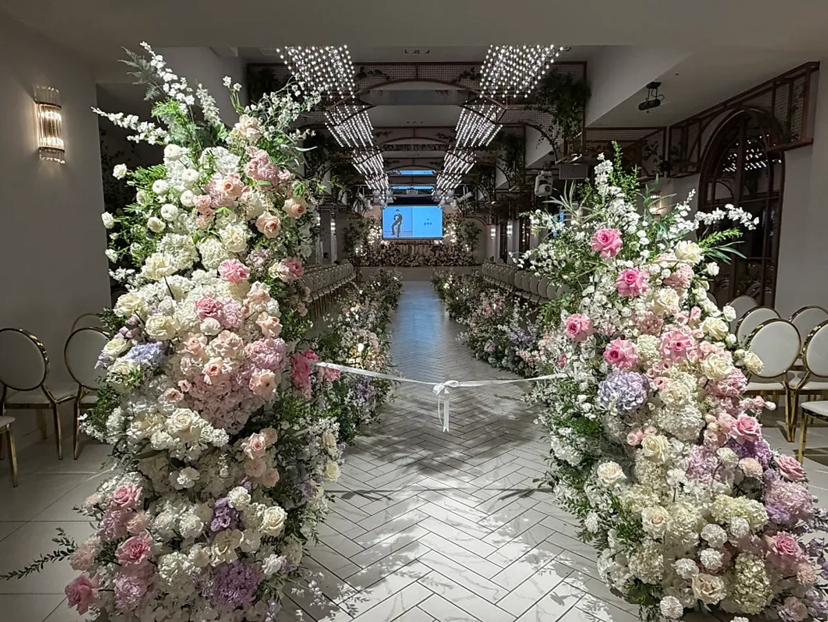 Arbe ceremony hall decorated with white and greenery flowers