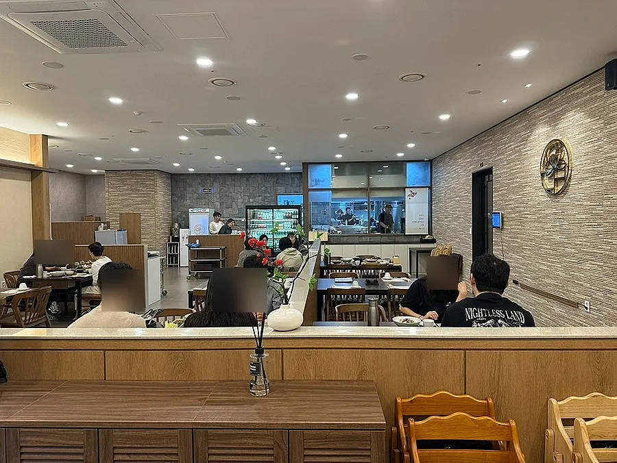Spacious, clean dining hall seating at Dongbaek Seokgalbi