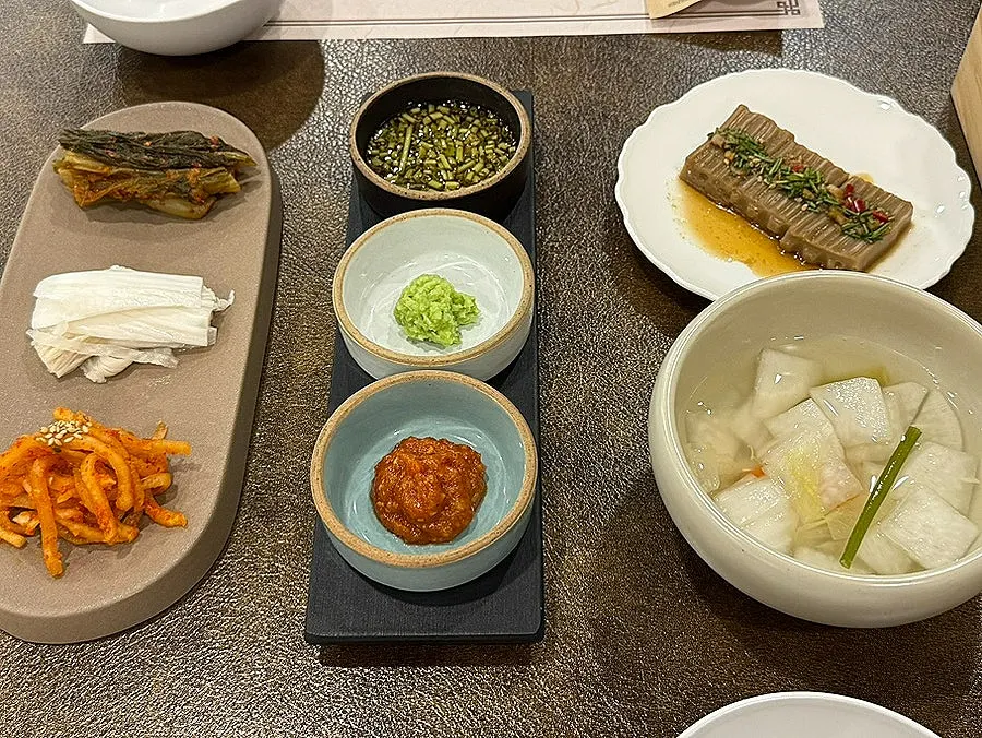 Neatly arranged side dishes and lettuce wraps