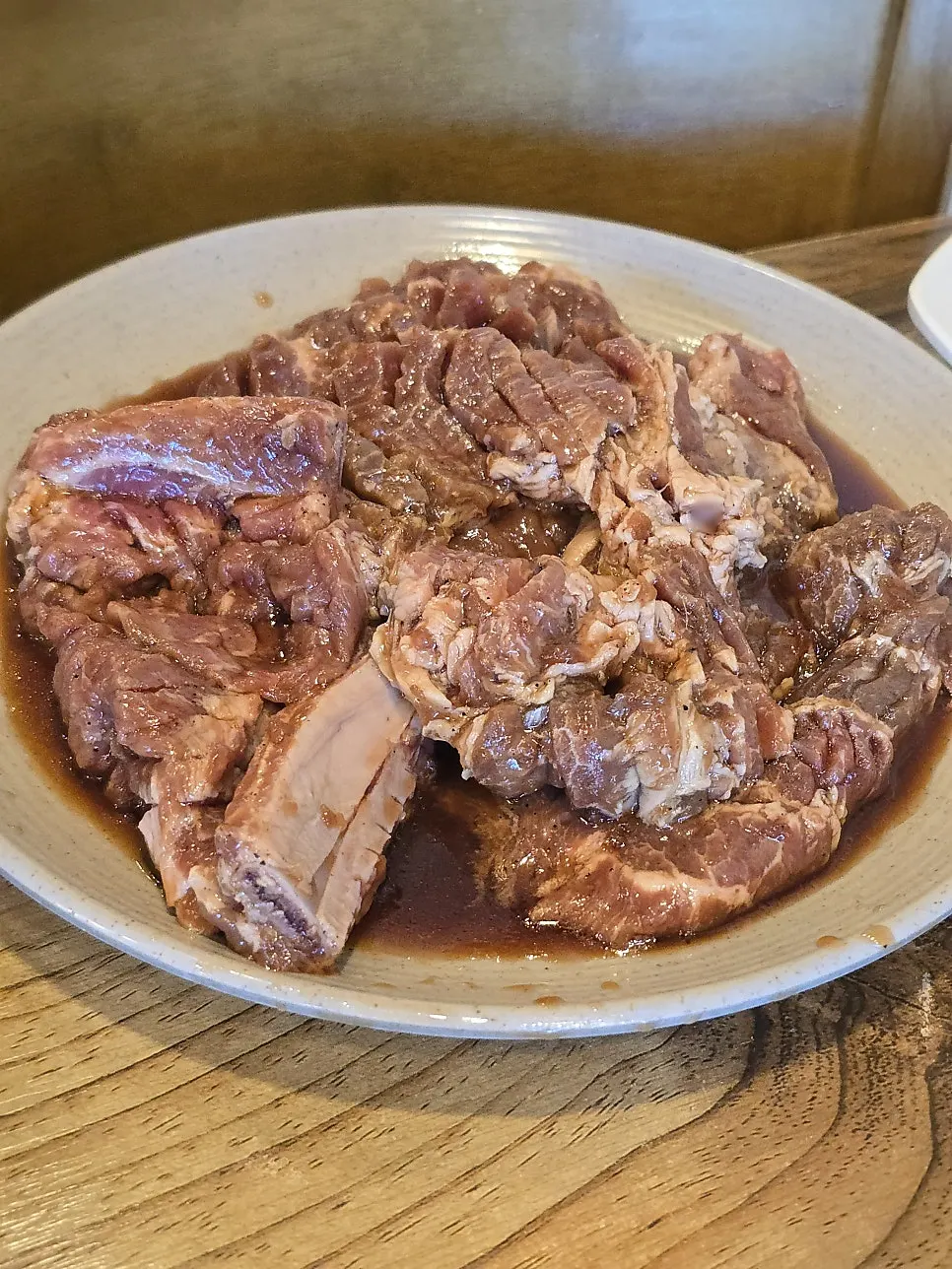 Pork galbi placed on the charcoal grill