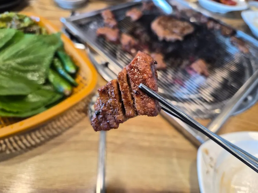 Marinated pork galbi cooking over charcoal