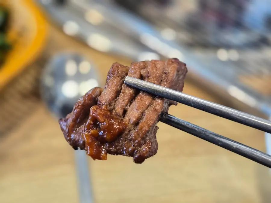 Pork galbi cut into bite-size pieces and grilled