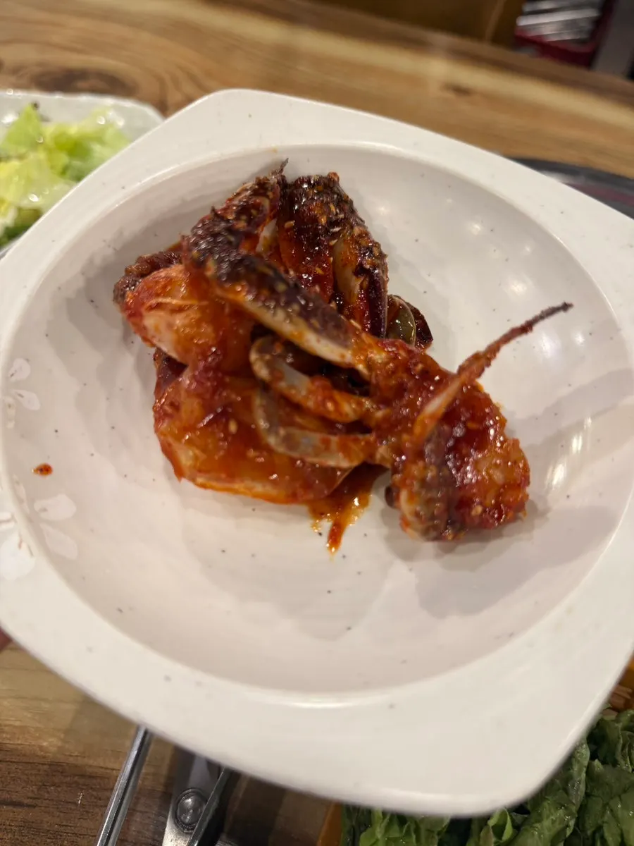 A stone bowl of doenjang stew with mud snails