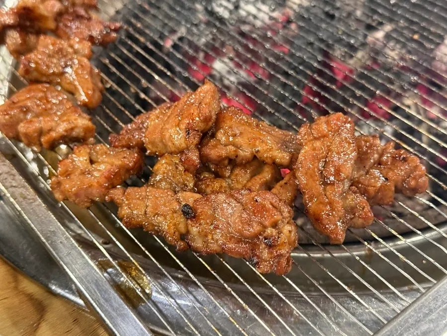 Fully grilled galbi alongside the extra corn order