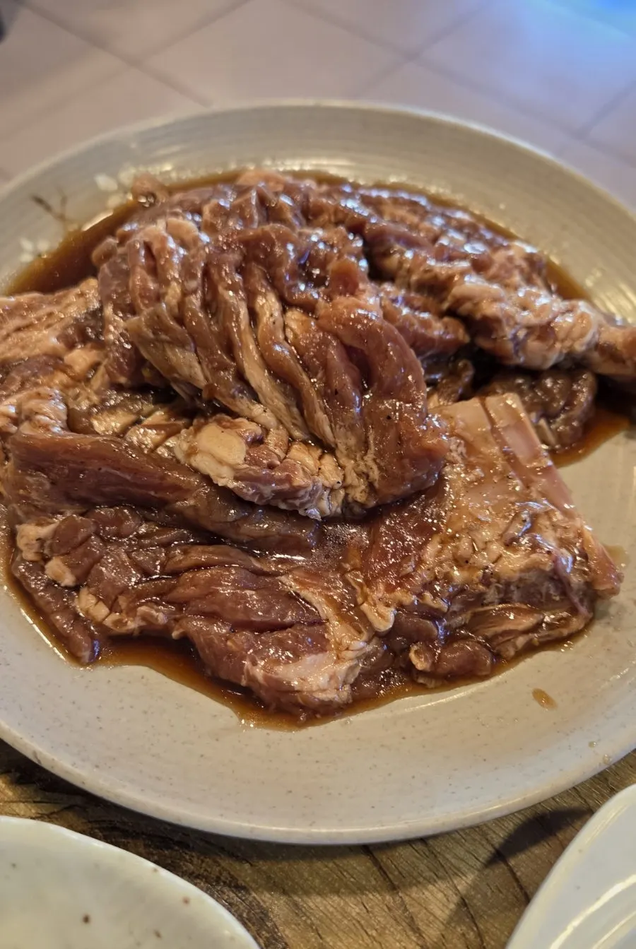 Bright red pork galbi before hitting the grill