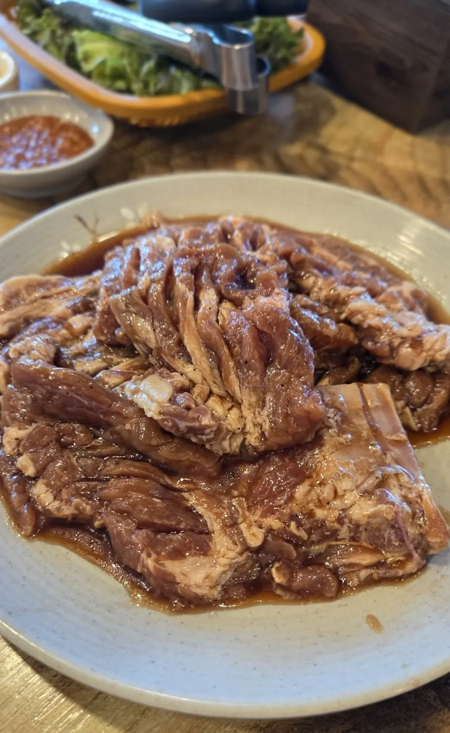 Pork galbi grilling over charcoal